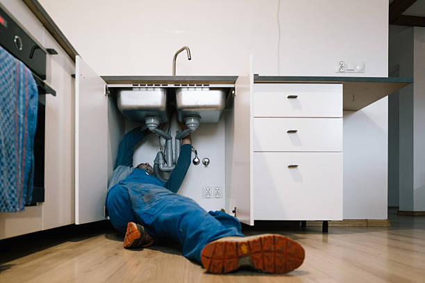 Professional Emergency Plumber technician working in Beach City, OH